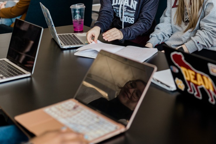 Laptops on a table where Dean College students are working