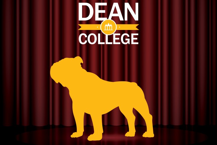 Dean College Bulldog in front of Theatre curtains