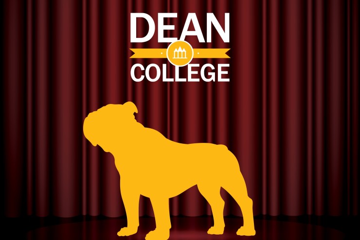 Dean College bulldog in front of theatre curtains