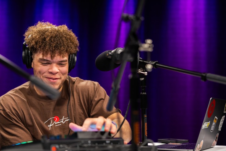 Student Speaking into Microphone in Studio