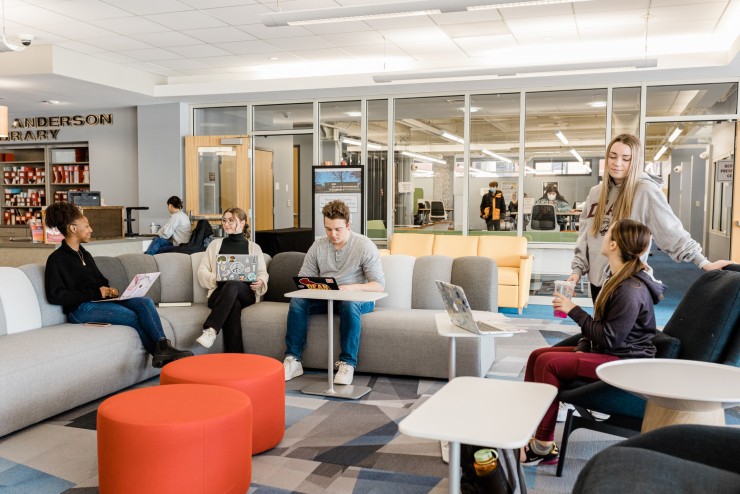 Dean College students working in the library