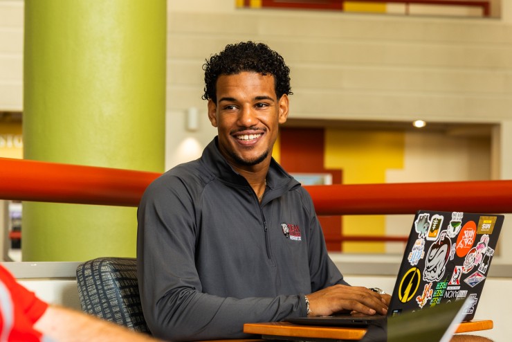 Student Sitting With Laptop