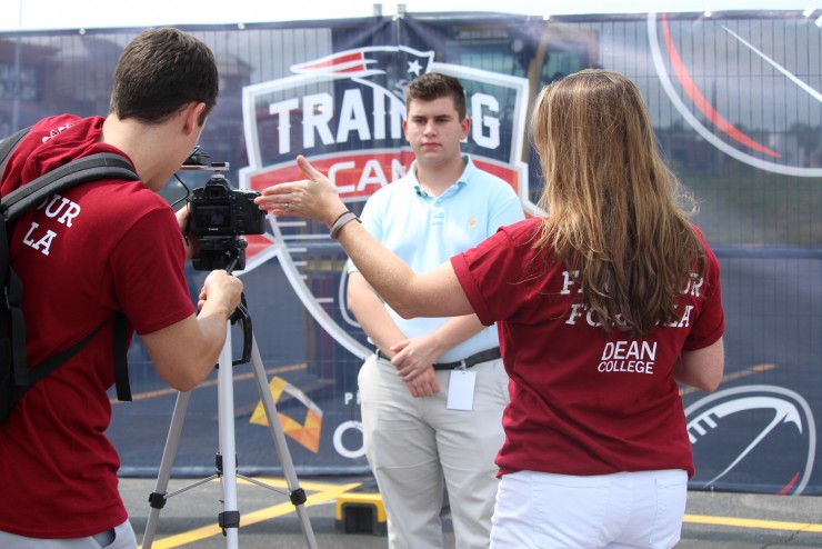 A student being filmed at the New England Patriots Training Camp at Gillette Stadium. 