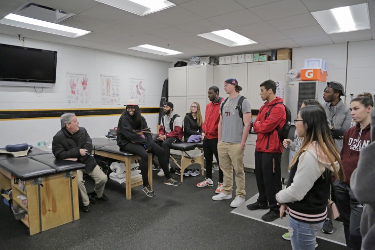 Dean College students on a tour of the Providence Bruins locker room