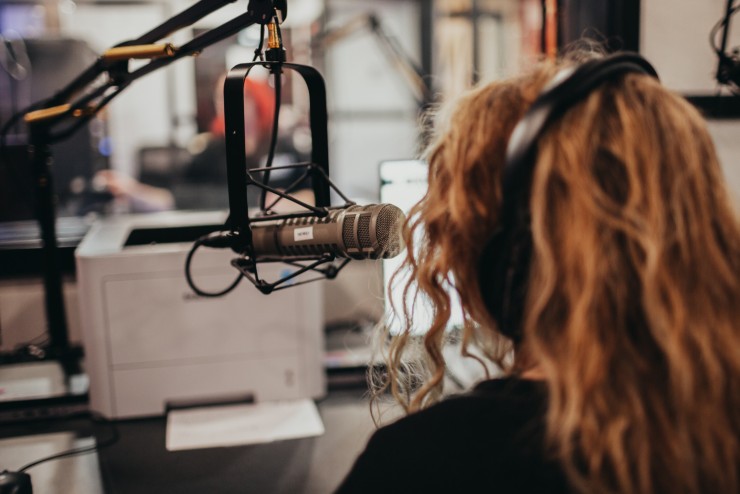 Student Speaking into Microphone
