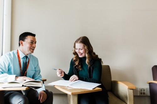 A Dean College professor helping two Dean College students. 