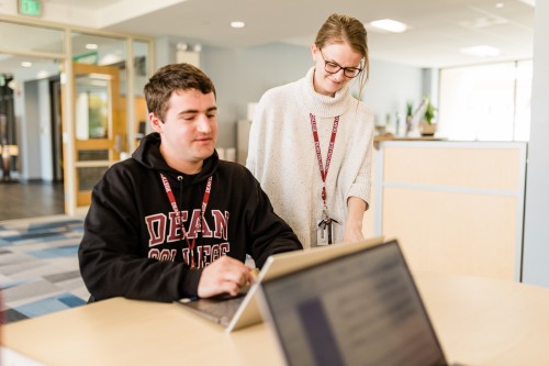 Dean College staff working with Dean College students