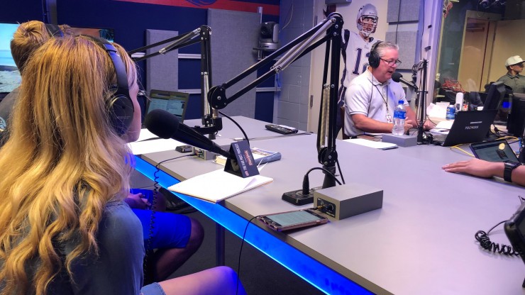 Dean College students in the Patriots radio station learning how to get into sports broadcasting