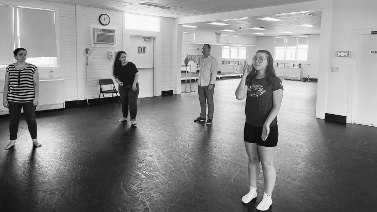 Black and white photo of Dean College student and faculty members dancing