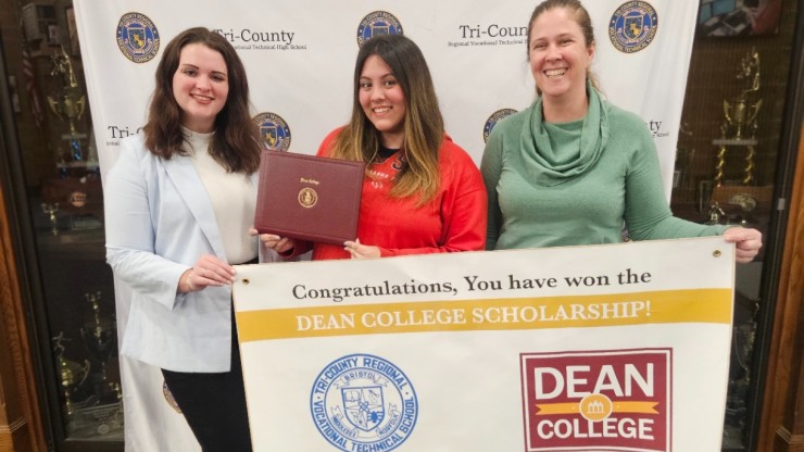 Ava Membreno receiving scholarship at event.