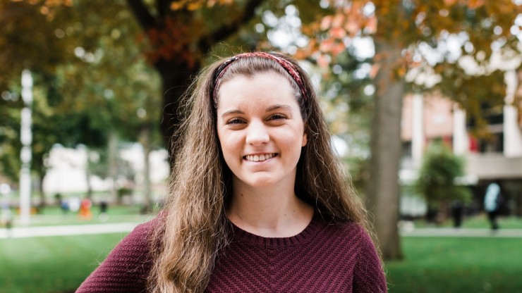 Student standing outside on campus